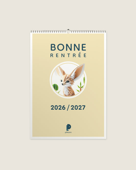 Calendrier mural à reliure spirale, couverture crème portant le titre Bonne Rentrée 2026 / 2027 et un fennec en papier plié dans un médaillon rond.